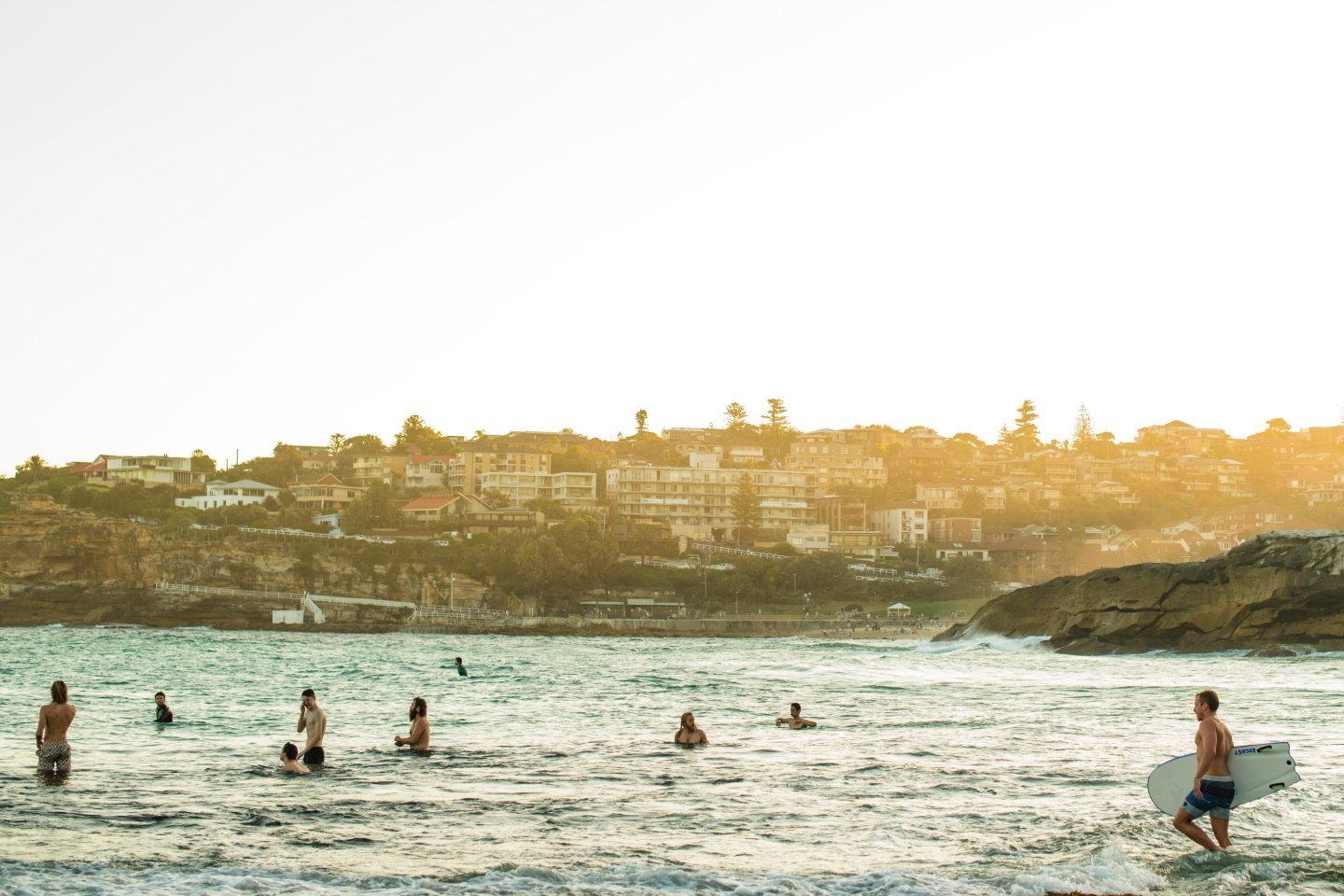 Young people in the surf at Bondi Beach in Sydney, Australia